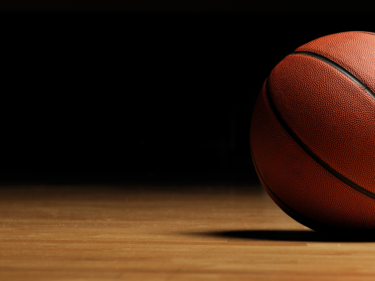 Basketball on gym floor