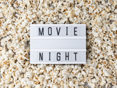 Text saying movie night on a pile of popcorn
