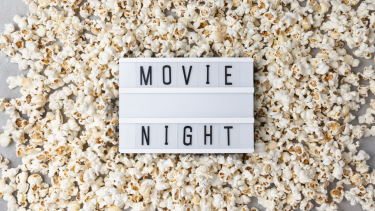 Movie Night Text saying movie night on a pile of popcorn