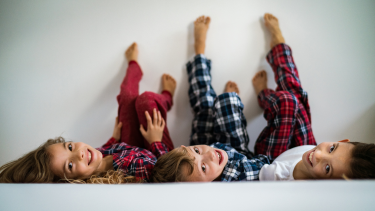 3 kids wearing pajamas