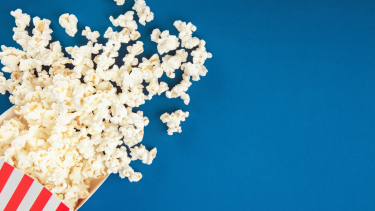 Bag of popcorn on a blue background