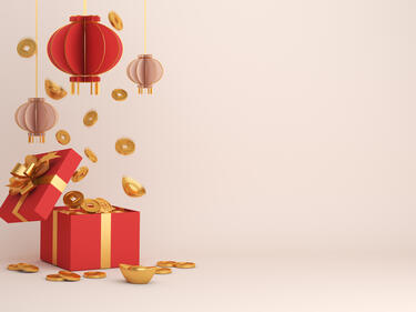 Chinese Lantern hanging over a box of coins