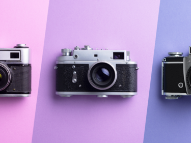 3 cameras on pink background